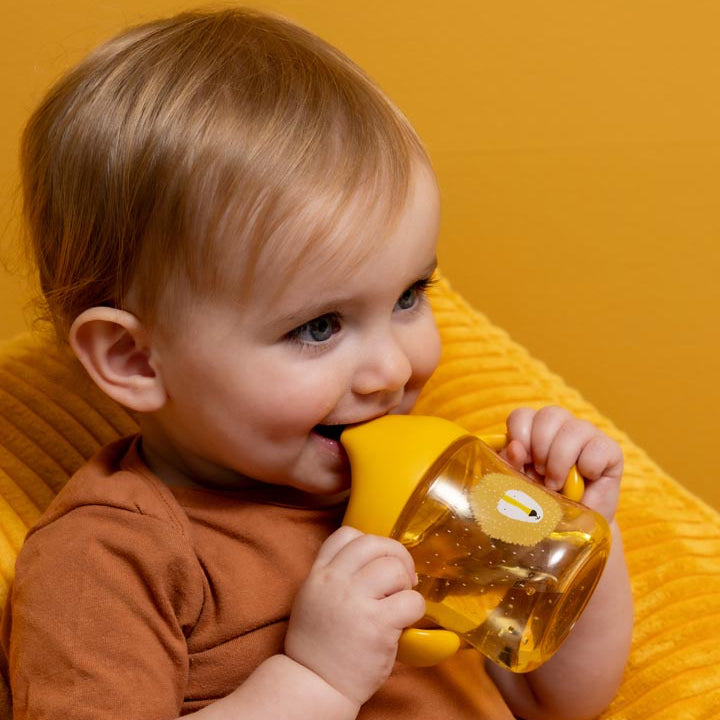 Taza con boquilla y asas TRIXIE · león