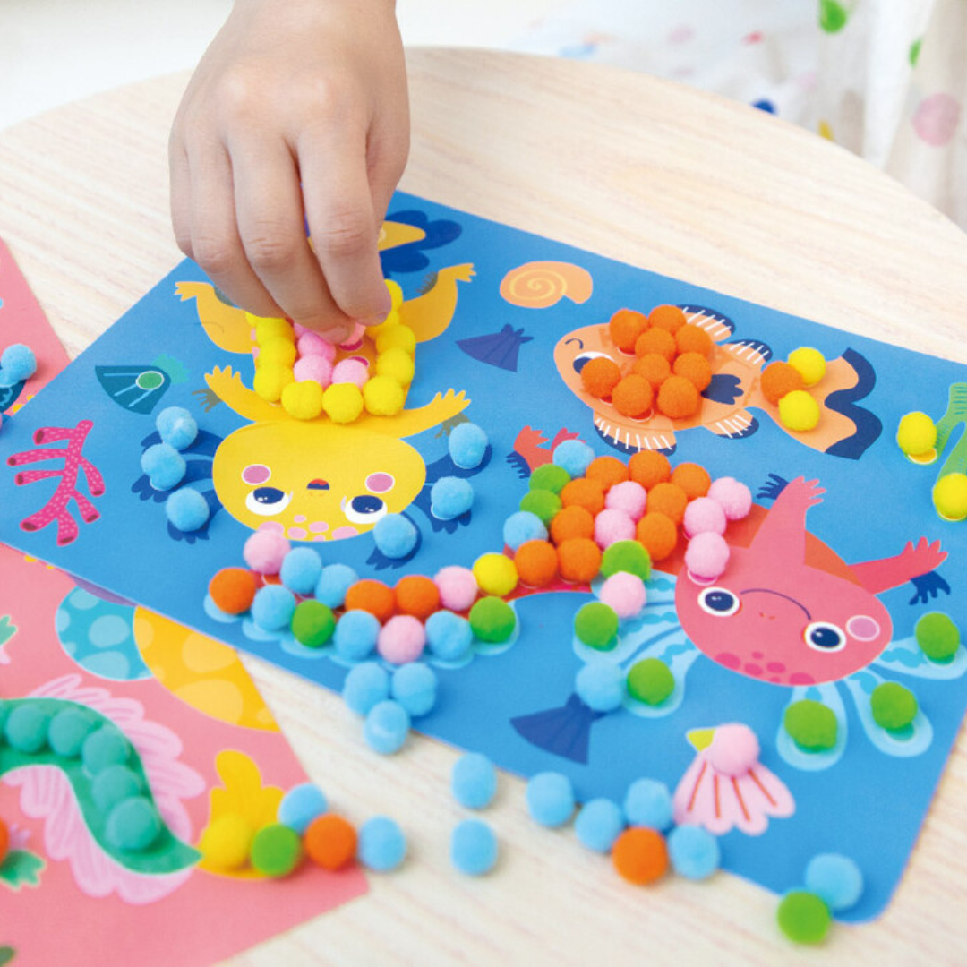 Arte con pompones y ajolotes